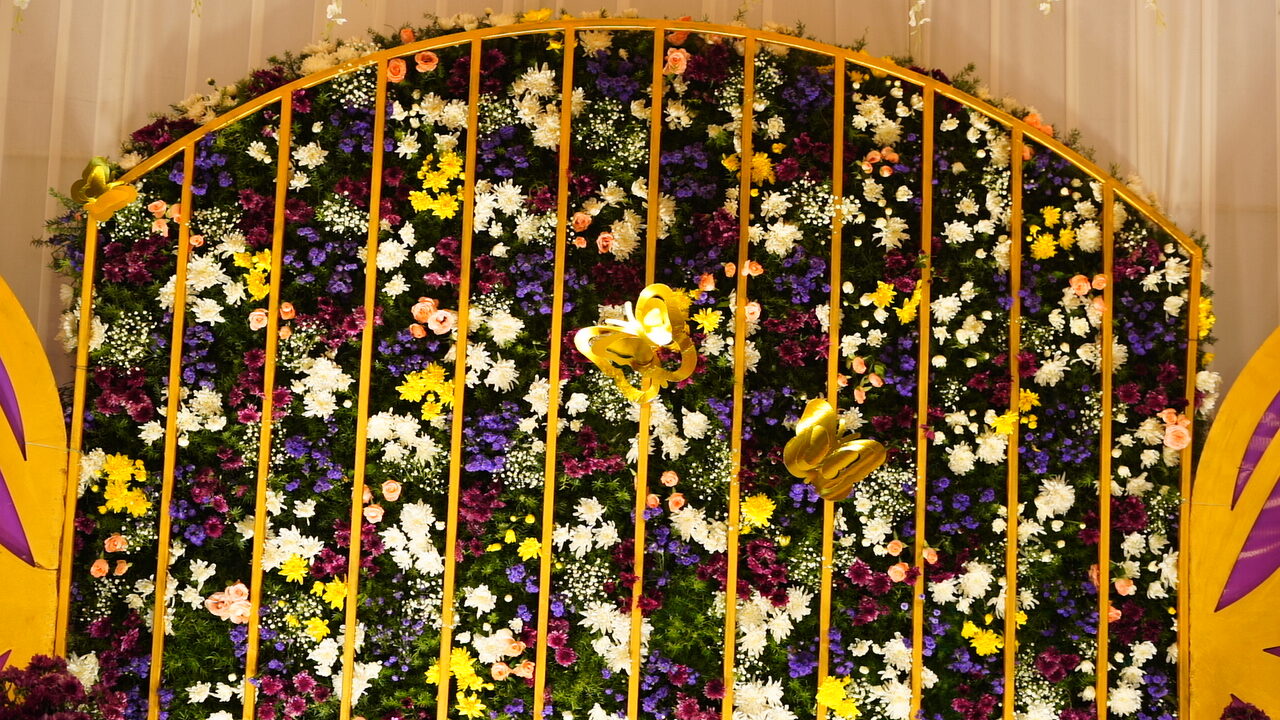 Vibrant floral stage decoration at Veduka hall, Bandlamudi Gardens Guntur