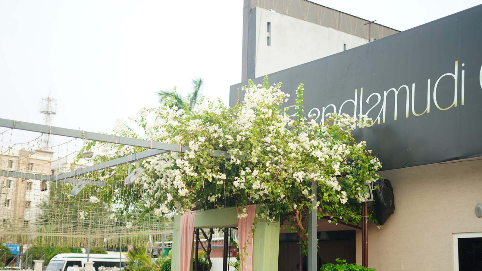 Exterior of Bandlamudi Gardens with greenery, Amaravathi Main Road Guntur